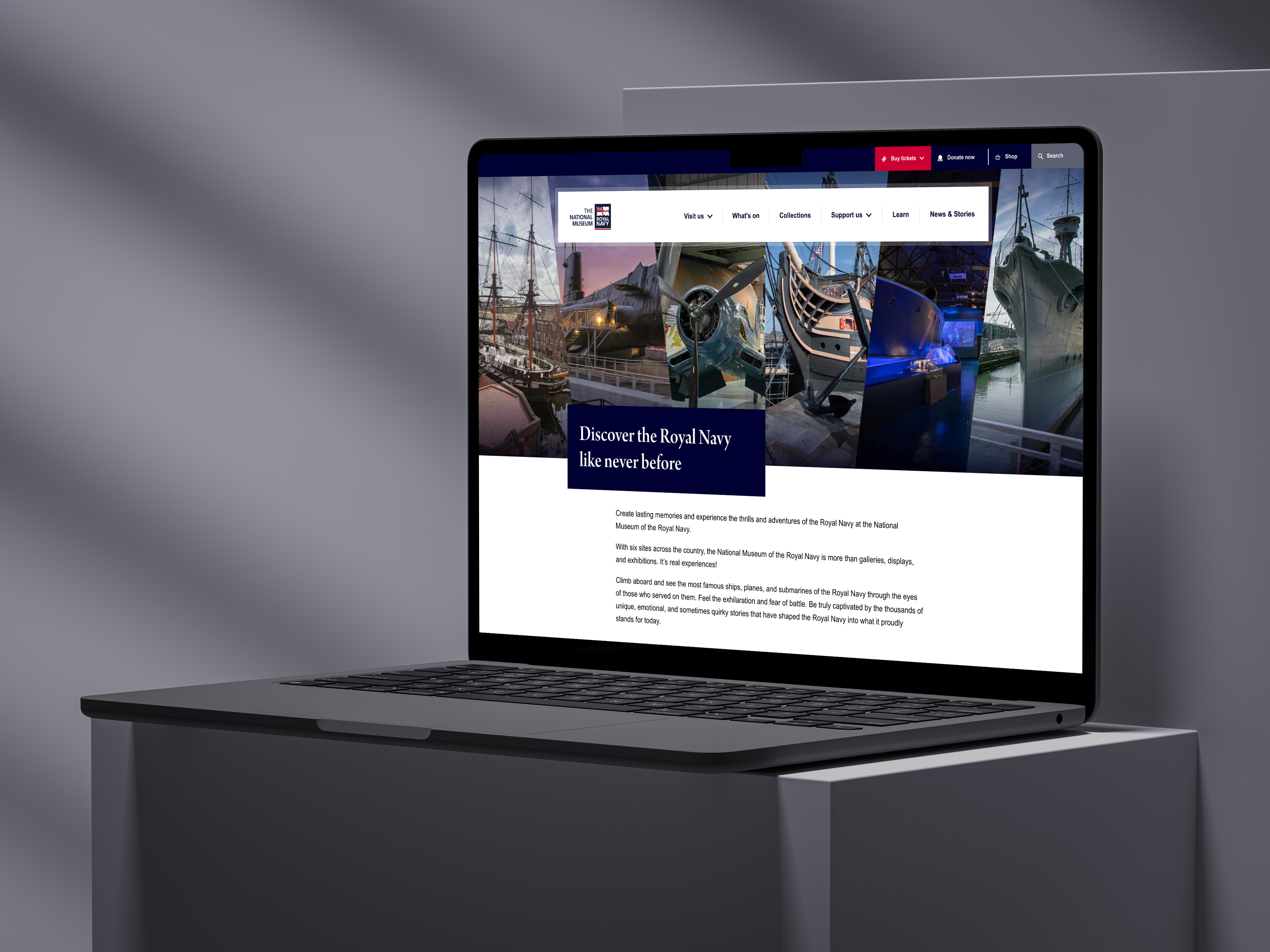 Open laptop on a raised platform with the NMRN homepage on screen