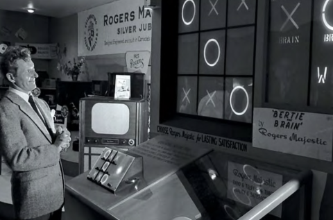 Man demonstrating an early tic-tac-toe computer